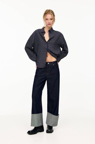 Jean Baggy À Revers Dans Le Bas - Pull&Bear - Modalova