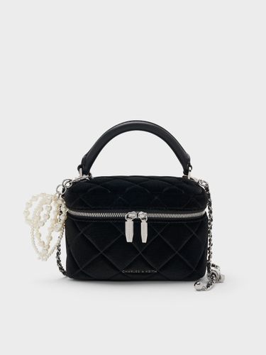 Vanity case matelassée en velours à poignée sur le dessus Arwen - Charles & Keith - Modalova
