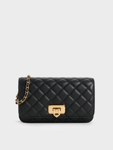 Pochette matelassée à bouton-poussoir Cressida - Charles & Keith - Modalova