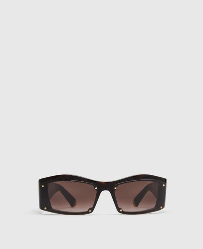 Lunettes de soleil géométriques avec médaillon - Stella McCartney - Modalova