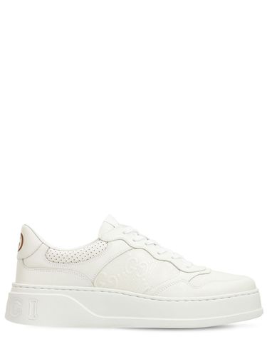 Sneakers En Cuir Embossé Gg - GUCCI - Modalova