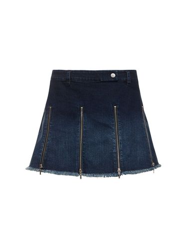 Jupe Courte En Denim À Plis Avec Zips - CANNARI CONCEPT - Modalova