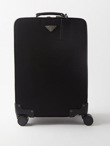Valise cabine en cuir et nylon à plaque logo - Prada - Modalova