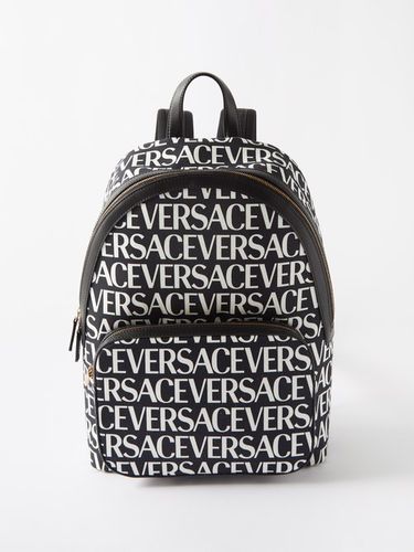 Sac à dos en toile enduite à imprimé logo - Versace - Modalova