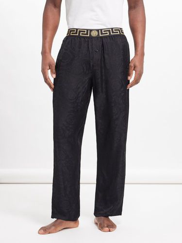 Pantalon de pyjama en satin à jacquard logo - Versace - Modalova