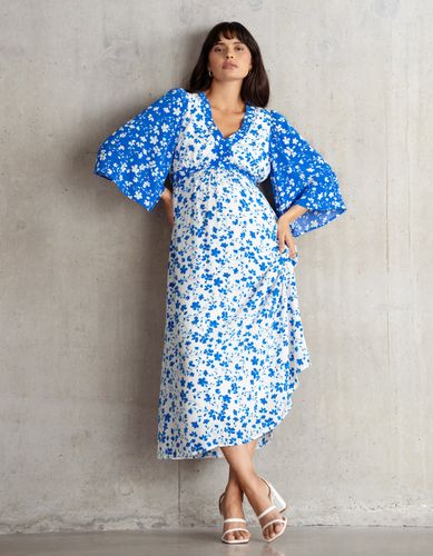 Robe de maternité et d'allaitement mi-longue à imprimé contrastant et motifs de pétales peints - Seraphine - Modalova