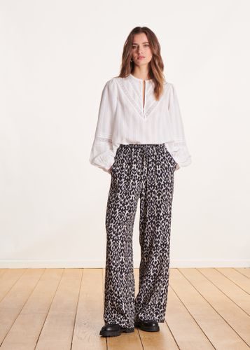 Pantalon fluide à imprimé noir et blanc taille élastique - La Fée Maraboutée - Modalova