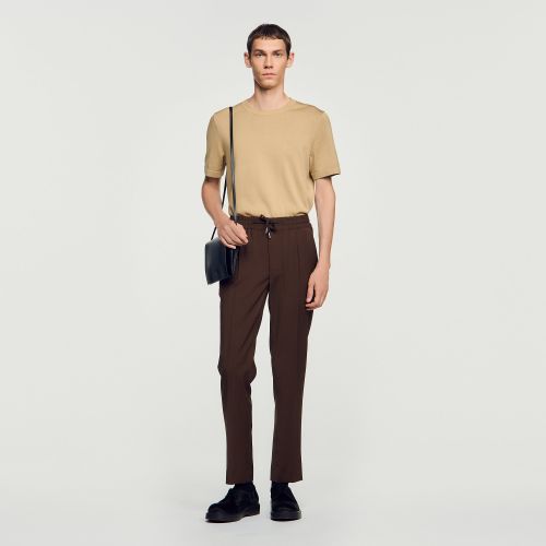 Pantalon élastiqué en laine - Sandro Paris - Modalova