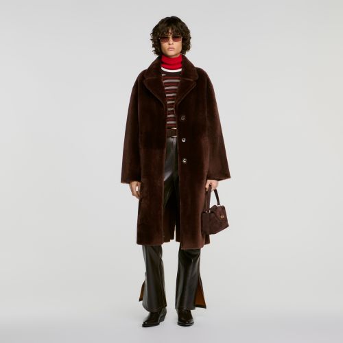 Manteau en peau lainée ceinturé - Sandro Paris - Modalova