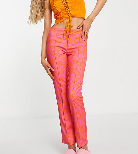 Pantalon slim taille basse à imprimé hibiscus - Collusion - Modalova