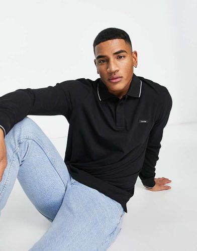 Polo à manches longues en piqué de coton stretch avec logo et liseré - Calvin Klein - Modalova