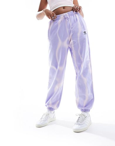 Pantalon de jogging effet tie-dye sur l'ensemble - Adidas Originals - Modalova