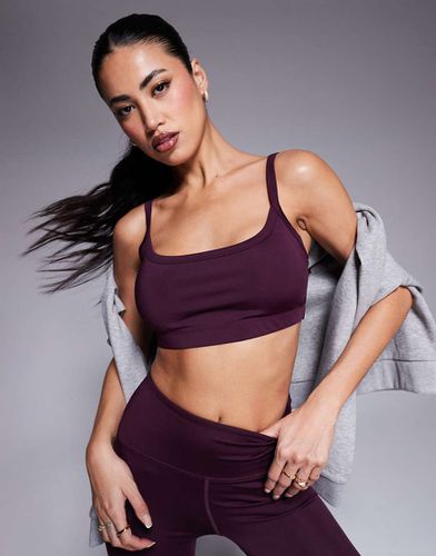 Brassière de sport maintien intermédiaire à rembourrage amovible - Bordeaux - Asos 4505 - Modalova