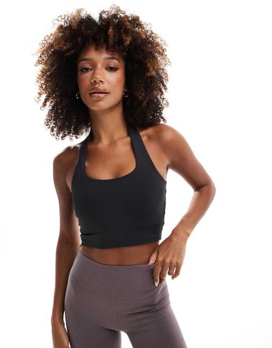 Top de sport dos nu avec soutien-gorge intégré - Asos 4505 - Modalova