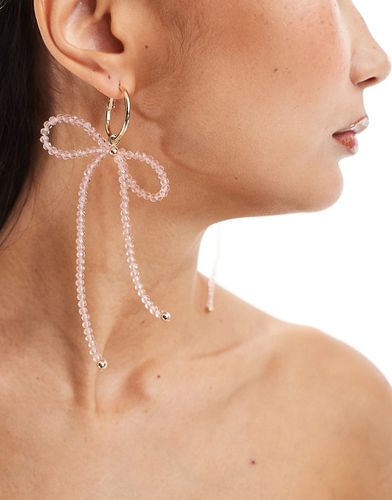 Boucles d'oreilles pendantes avec naud orné de perles à facettes - Rose et - Asos Design - Modalova