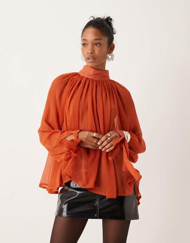 Blouse transparente à col montant et liens aux poignets - Rouille - Asos Design - Modalova