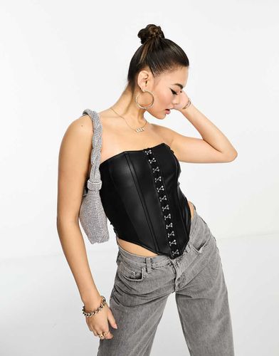 Bustier à agrafes style corset en similicuir - Asos Design - Modalova