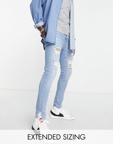 Jean effet seconde peau en tissu power stretch avec détail sur l'ourlet - clair délavé - Asos Design - Modalova