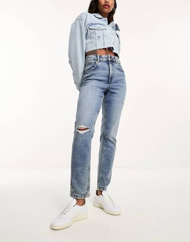 Jean mom slim à déchirures - moyen - Asos Design - Modalova