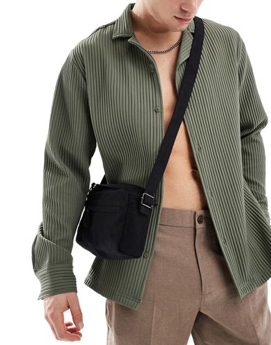 Sac bandoulière en coton doux avec poche à l'avant - Asos Design - Modalova