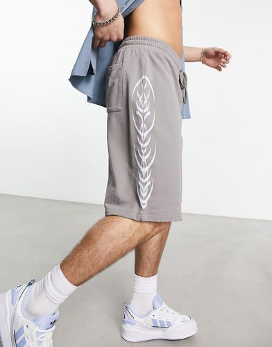 Short de basketball oversize avec imprimé sur le côté effet rongé - Asos Design - Modalova