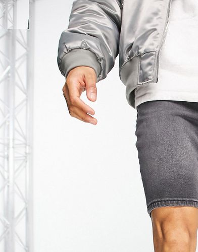 Short en jean skinny classique - rétro délavé - Asos Design - Modalova