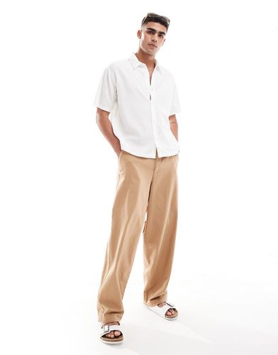 Pantalon chino large en lin - Marron - Asos Design - Modalova