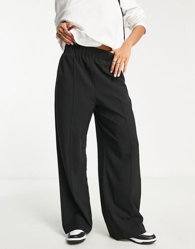 Pantalon ajusté à taille élastique - Asos Design - Modalova