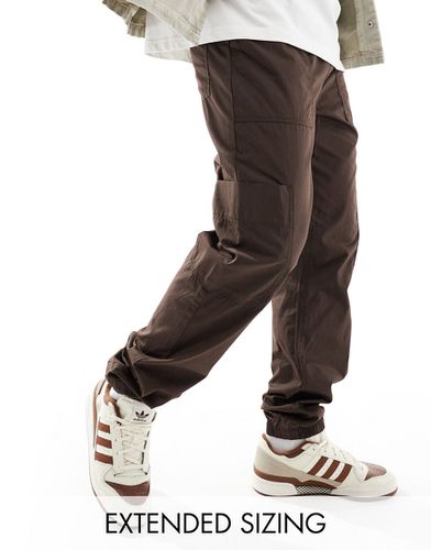 Pantalon de jogging cargo à enfiler avec taille élastique - Marron - Asos Design - Modalova