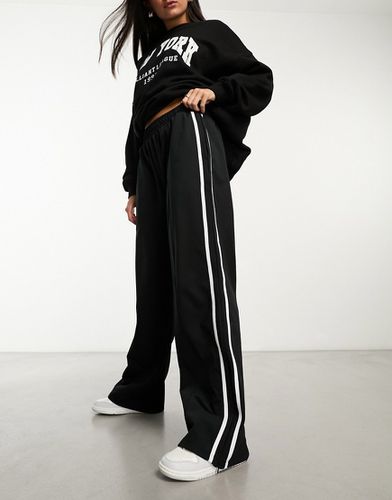 Pantalon de jogging large à bandes latérales - Asos Design - Modalova