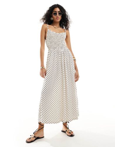 Robe mi-longue avec corsage effet froissé et jupe évasée à fines bretelles - Noir et blanc à pois - Asos Design - Modalova