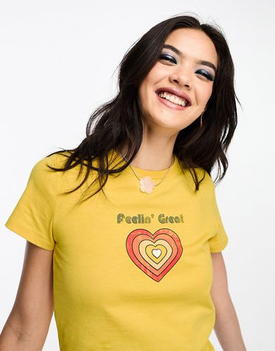 T-shirt raccourci avec motif Feeling Great style années 70 - Asos Design - Modalova