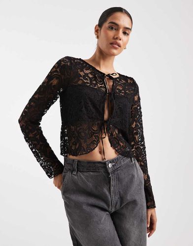 Top manches longues en dentelle avec liens devant - Asos Design - Modalova