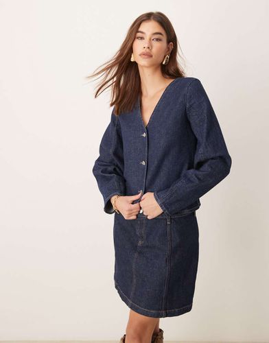 Veste en jean surpiquée à manches façonnées - Indigo - Asos Design - Modalova