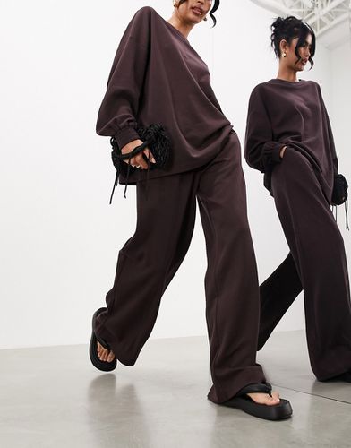 Premium - Pantalon ample plissé à l'avant en jersey texturé - Marron - Asos Edition - Modalova
