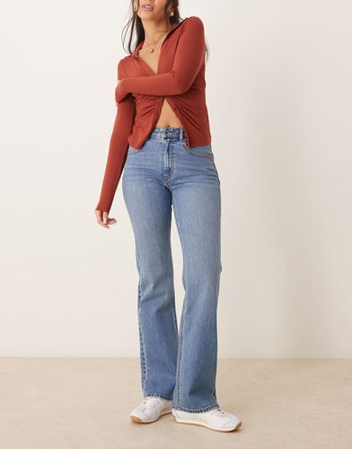 Jean bootcut stretch à taille haute - délavé moyen - Gina Tricot - Modalova