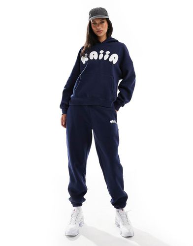 Pantalon de jogging d'ensemble resserré aux cheville avec logo style bulles - Kaiia - Modalova