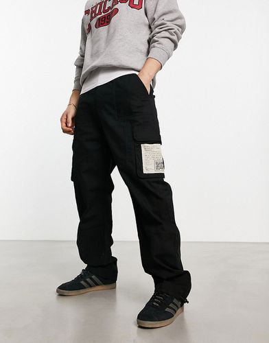 Pantalon cargo signature avec écusson en tissu - Noir - Karl Kani - Modalova