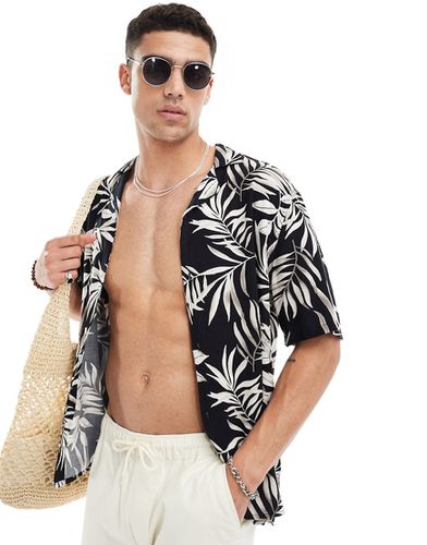 Chemise à manches courtes et col cranté en rayonne avec imprimé fleurs tropicales - Hollister - Modalova