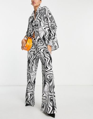 Pantalon d'ensemble large à imprimé abstrait - et blanc - Lola May - Modalova
