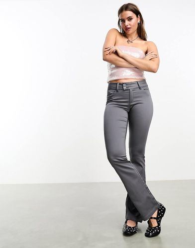 Pantalon évasé skinny à taille basse - Monki - Modalova