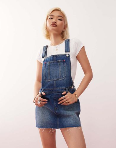 Robe salopette courte en jean - dlav - Monki - Modalova