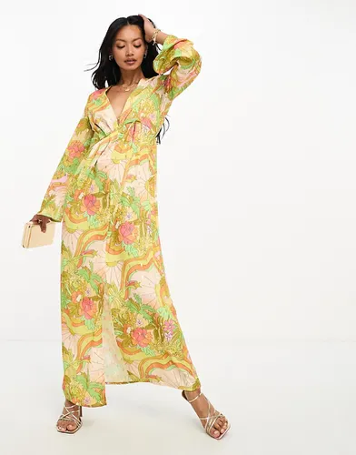 Robe plissée longue à décolleté plongeant et imprimé coucher de soleil tropical - Never Fully Dressed - Modalova