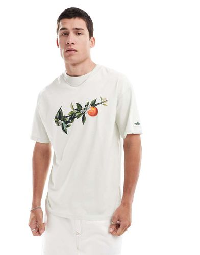 T-shirt unisexe avec logo virgule et imprimé branche - Vert pâle - Nike - Modalova