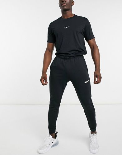 Dri-Fit - Jogger fuselé en polaire - Nike Training - Modalova