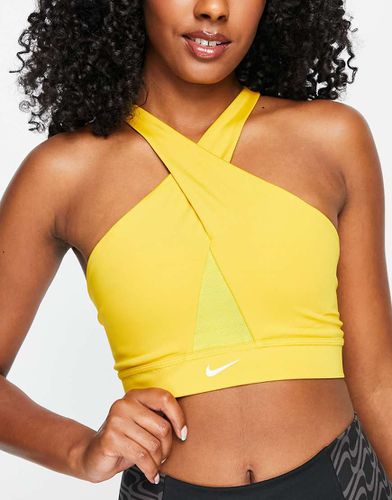 Icon Clash - Brassière de sport maintien léger en tissu Dri-FIT avec logo virgule et encolure croisée - foncé - Nike Training - Modalova