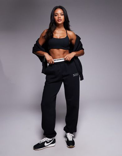 Phoenix Fleece - Gym Life - Pantalon de jogging oversize  logo virgule et dtail style caleon - Nike - Modalova