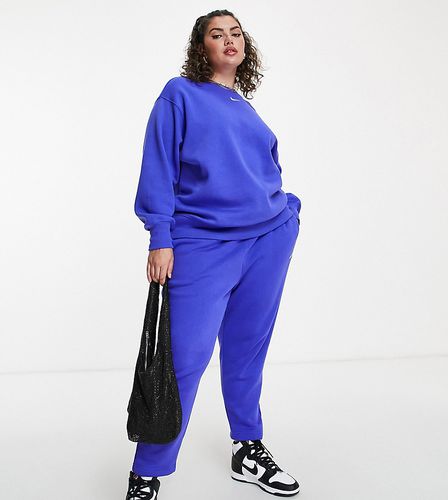 Nike Plus - Pantalon de jogging large taille haute avec petit logo virgule  - Noir et voile