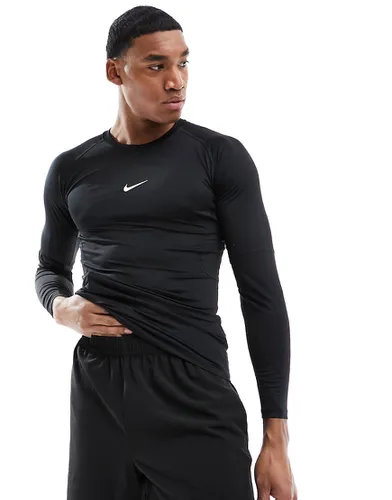 Nike Pro - T-shirt de sport à manches longues et logo virgule en tissu Dri-FIT - Nike Training - Modalova