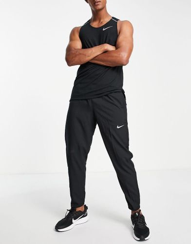 Challenger - Jogger en tissu Dri-FIT - Nike Running - Modalova